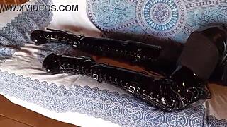 Milf In Black Lingerie, Fishnets, Pantyhose, And Over-The-Knee Boots Poses Seductively