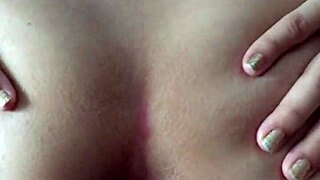 Latin girl poses from behind in a casual setting.