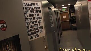 Hey, watch this busty whore suck at the gloryhole!