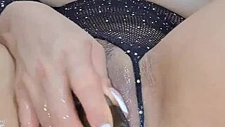 Sexy girl fingers herself and fucks her pussy with a big eggplant