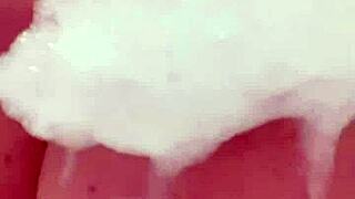 Horny British slut fingers herself in the shower