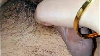 Priya, the housewife, slowly rubs her husband's cock until he cums