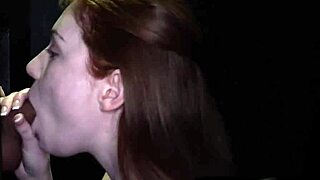 Flaming Redhead Babe Sucking Hard at the Gloryhole Every Time