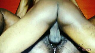 Man, my ebony girlfriend is wild! She's sucking and stroking a black cock like a pro with that big ass.