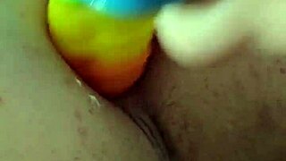I love how this fat brunette toys her ass with rainbow dildo for gaping creampie