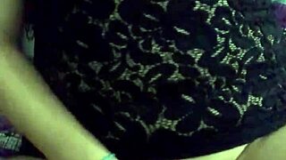 Julia Soto teases in sexy black lingerie while pleasuring herself in a private moment.
