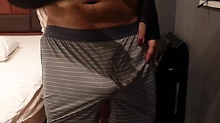 The bitch femdom rubs and slaps cock and balls while getting excited