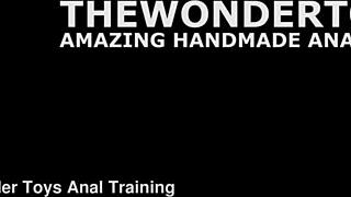 Rousse black tests huge dildo with anal fisting.