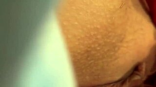 Oiled blonde masturbates to orgasm close up