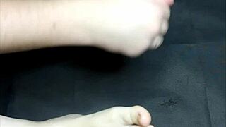 A gentle oiled foot massage turns femdom in this homemade video.