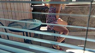 hidden cam spies on teen ass under skirt on balcony