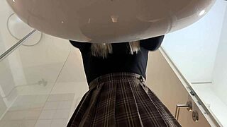 Hot blonde babe with big tits and ass strips fiercely in the bathroom.