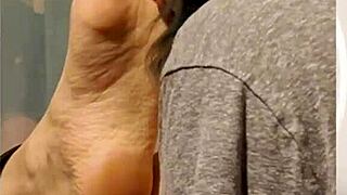 Licking feet slowly and thoroughly