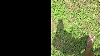 tall black woman stomps in garden, everything looks small from up here