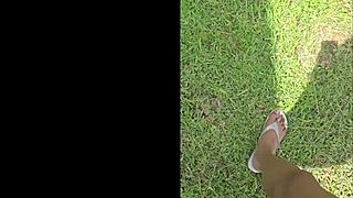 tall black woman stomps in garden, everything looks small from up here