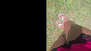 tall black woman stomps in garden, everything looks small from up here