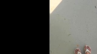 tall black woman stomps in garden, everything looks small from up here