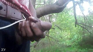 A guy masturbates outdoors and shoots his cum all over the trees in a casual cumshot scene