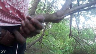 A guy masturbates outdoors and shoots his cum all over the trees in a casual cumshot scene
