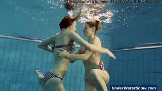 horny teen girls strip each other in the pool underwater