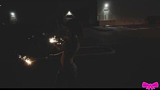 topless girls celebrate outdoors with sparklers at the party