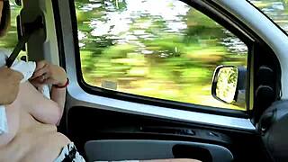 Housewife flashing tits out on the road!