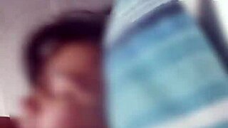 Close-up of a couple in a dorm homemade scene.