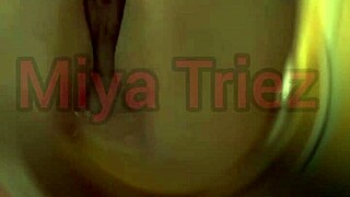 miya triez performs a teasing striptease
