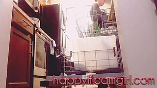 Tall girl ignores cleaning in kitchen voyeur recording