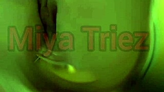 miya triez performs a teasing striptease