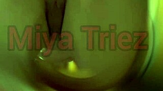 miya triez performs a teasing striptease