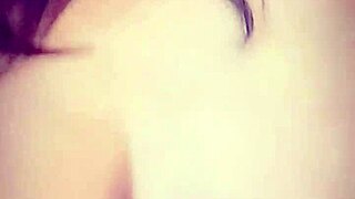 Asian milf shows big tits in blue satin on webcam