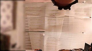 Big-ass servant folds clothes with no panties, spied in real time