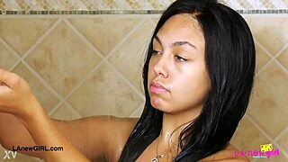 amazing brunette with sexy body enjoys a relaxing shower after bathing