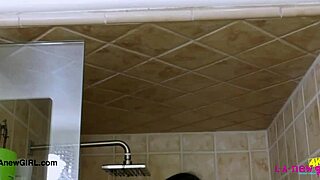 amazing brunette with sexy body enjoys a relaxing shower after bathing