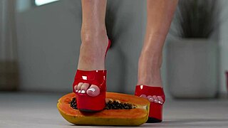 petite girl crushes fruits with high heels in hot footfetish