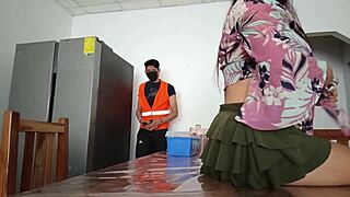 The maintenance man checks the fridge while the housewife shows her vagina
