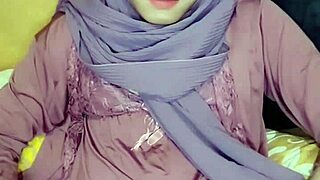 asian crossdresser in hijab masturbates solo in indonesian setting