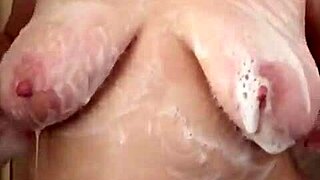 My big boob girlfriend is showering and washing her hair and shaving
