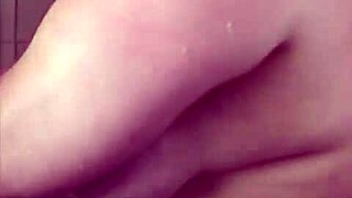 My big boob girlfriend is showering and washing her hair and shaving