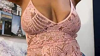 Watch Anna Maria strip in pink lingerie, teasing her big tits and ass?