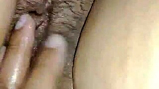 oiled girl enjoys boyfriend's touch