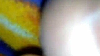 mommy gives a quick handjob to her big cock in bed