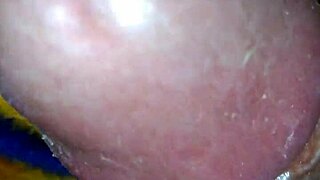 mommy gives a quick handjob to her big cock in bed