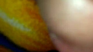 mommy gives a quick handjob to her big cock in bed