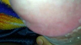 mommy gives a quick handjob to her big cock in bed