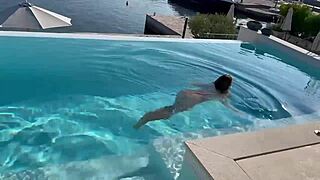 Gorgeous Monika Fox swims naked in the pool in a beautiful place