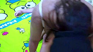 Aunt enjoys homemade fun with nephew in Indonesian setting.