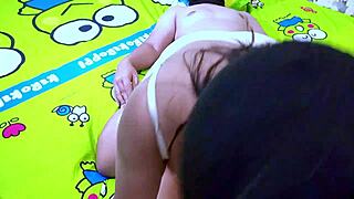 Aunt enjoys homemade fun with nephew in Indonesian setting.