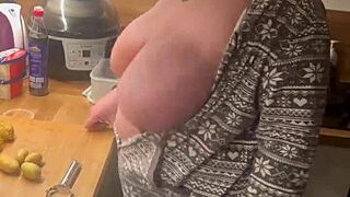In the kitchen, the two big tits bounced as she gave a handjob.